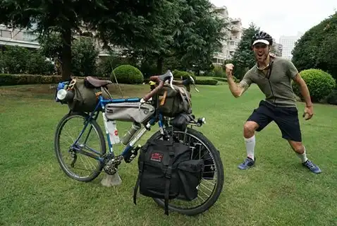 Cyclist Alessandro Gallo with Carradice bags crossing China