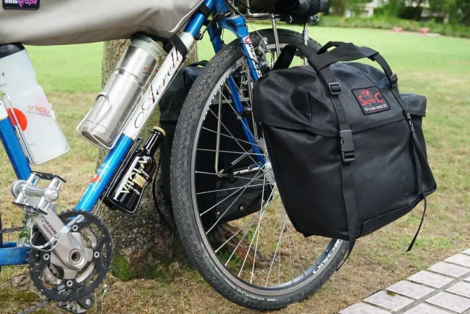 Cyclist Alessandro Gallo with Carradice bags crossing China