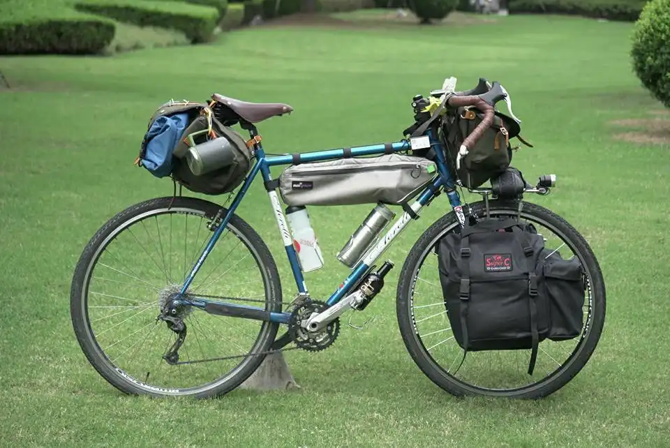 Cyclist Alessandro Gallo with Carradice bags crossing China