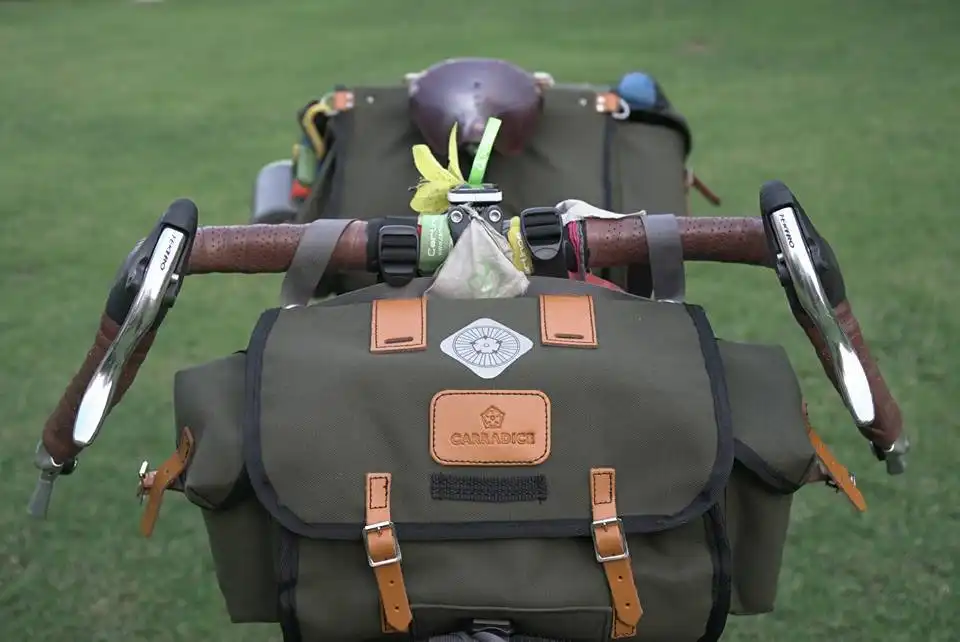 Cyclist Alessandro Gallo with Carradice bags crossing China