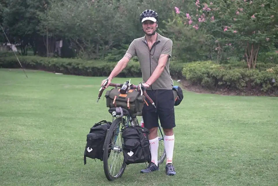Cyclist Alessandro Gallo with Carradice bags crossing China